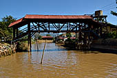 Inle Lake Myanmar. All the buildings are constructed on piles. Residents travel around by canoe, but there are also bamboo walkways and bridges over the canals, monasteries and stupas. 